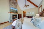 26.  Master bedroom with fireplace & flat screen TV